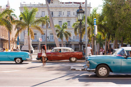 CUBA, HAVANA - MAY 5, 2017: American multicolored retro cars on city street. Copy space for text