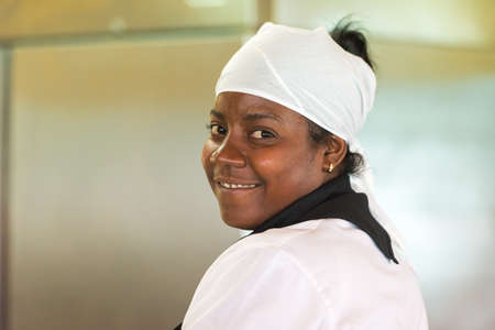 CAYO LARGO, CUBA - MAY 10, 2017: Portrait of a woman cookのeditorial素材