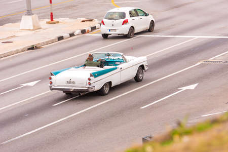 CUBA, HAVANA - MAY 5, 2017: American white retro cabriolet on city street. Copy space for text