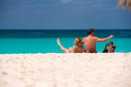 CAYO LARGO, CUBA - MAY 8, 2017: Man and woman on the beach Playa Paradise. Copy space for textのeditorial素材