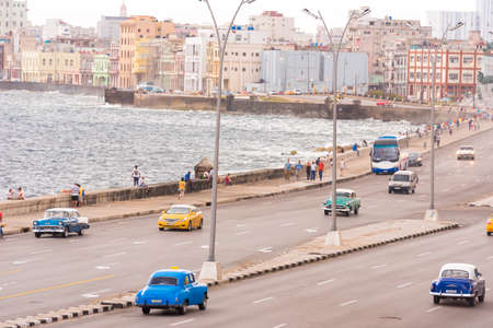 CUBA, HAVANA - May 5, 2017: American beige retro-car rides along the seafront Malokon. Copy space for textのeditorial素材