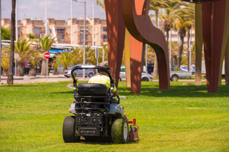 Lawn mower on the waterfront in La Pineda, Tarragona, Catalunya, Spain. Copy space for textの写真素材