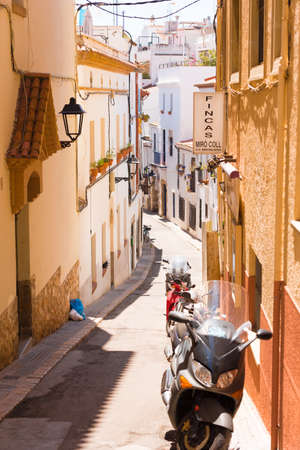 Little street of the historic city center Sitges, Barcelona, Catalunya, Spain. Verticalの写真素材