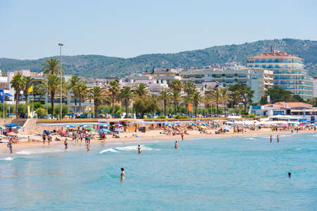 SITGES, CATALUNYA, SPAIN - JUNE 20, 2017: View of the sandy beach and promenade. Copy space for textのeditorial素材