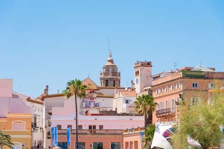 SITGES, CATALUNYA, SPAIN - JUNE 20, 2017: View of the historical center and the ï¿½hurch of Sant Bartomeu and Santa Tecla. Copy space for text. Isolated on blue backgroundのeditorial素材