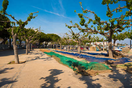 Colorful fishing nets in the port Cambrils, Catalonia, Spain. Copy space for text