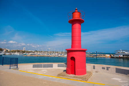 Red lighthouse in Cambrils, Catalunya, Spain. Copy space for textの写真素材