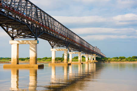 Steel bridge over the Irrawaddy river in Mandalay, Myanmar, Burma. Copy space for textの写真素材