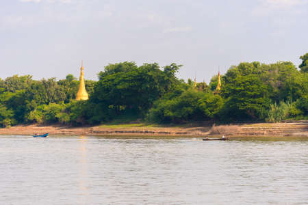 One pagoda on the banks of the Irrawaddy river, Mandalay, Myanmar, Burma. Copy space for textの写真素材