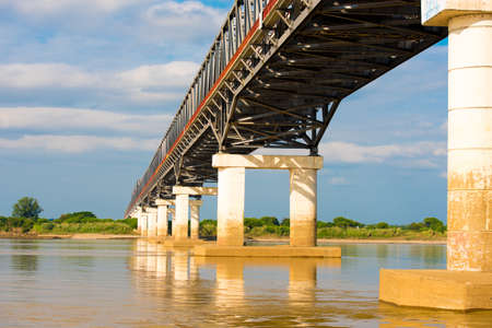 Steel bridge over the Irrawaddy river in Mandalay, Myanmar, Burma. Copy space for textの写真素材