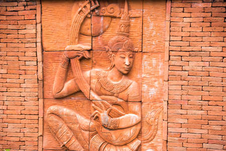 Thai god, bas-relief. Close-upの写真素材