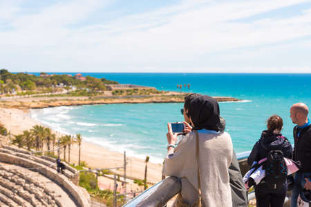 TARRAGONA, SPAIN - MAY 1, 2017: Tourists photograph the roman amphitheater. Copy space for textのeditorial素材
