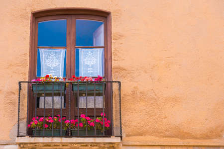 TARRAGONA, SPAIN - MAY 1, 2017: European balcony with flowers. Copy space for textのeditorial素材