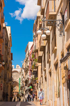 TARRAGONA, SPAIN - MAY 1, 2017: The street leading to the cathedral (Catholic cathedral). European street. Verticalのeditorial素材
