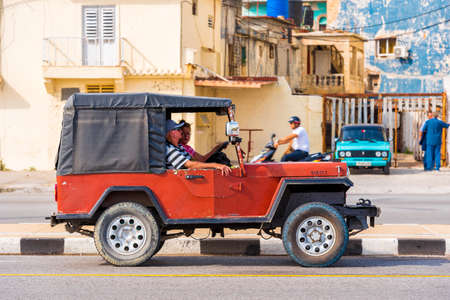 CUBA, HAVANA - MAY 5, 2017: Red jeep on Havana street. Copy space for textのeditorial素材