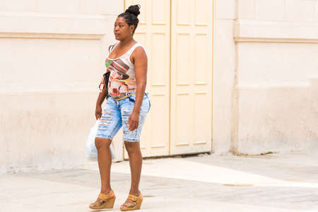 CUBA, HAVANA - MAY 5, 2017: Woman on a city street. Copy space for textのeditorial素材