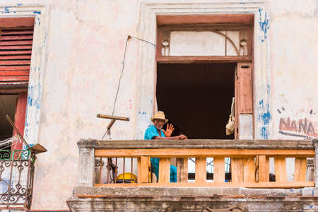 CUBA, HAVANA - MAY 5, 2017: Cuban man on the balcony. Copy spaceのeditorial素材