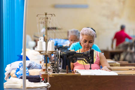 CUBA, HAVANA - MAY 5, 2017: Workers at the garment factory. Copy spaceのeditorial素材