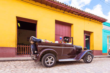 TRINIDAD, CUBA - MAY 16, 2017: American retro car on the street. Copy space for textのeditorial素材