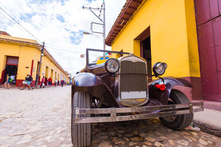 TRINIDAD, CUBA - MAY 16, 2017: American retro car on the street. Copy space for textのeditorial素材