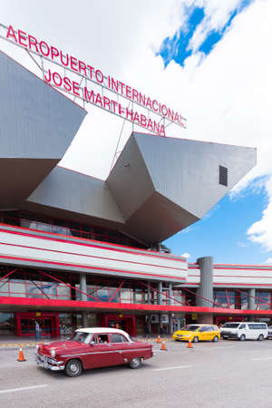 CUBA, HAVANA - MAY 5, 2017: Cars near the airport building. Copy space for text. Verticalのeditorial素材