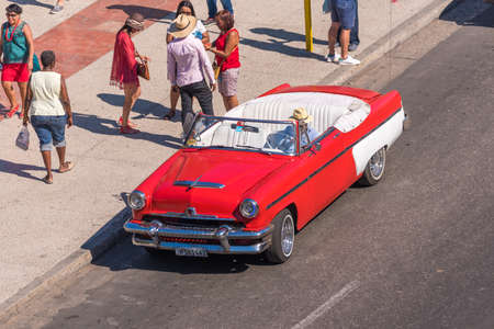 CUBA, HAVANA - MAY 5, 2017: American red retro cabriolet on city street. Copy space for textのeditorial素材