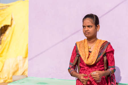 PUTTAPARTHI, ANDHRA PRADESH, INDIA - JULY 9, 2017: Portrait of an Indian girl. Copy space for text