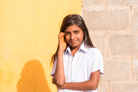 PUTTAPARTHI, ANDHRA PRADESH, INDIA - JULY 9, 2017: Portrait of an Indian girl. Copy space for textのeditorial素材