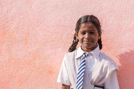 PUTTAPARTHI, ANDHRA PRADESH, INDIA - JULY 9, 2017: Portrait of an Indian girl. Copy space for textのeditorial素材