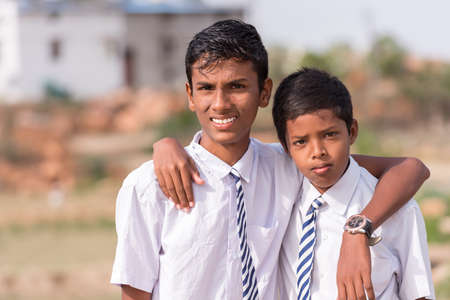 PUTTAPARTHI, ANDHRA PRADESH, INDIA - JULY 9, 2017: Portrait of two Indian boys. Close-up