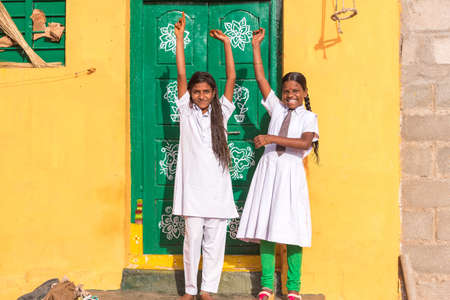 PUTTAPARTHI, ANDHRA PRADESH, INDIA - JULY 9, 2017: Cheerful Indian schoolgirls. Copy space for text