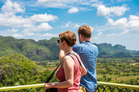 Woman and man in the background of the valley of Vinales. Copy space for textのeditorial素材