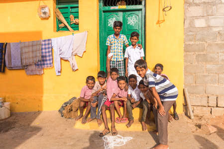 PUTTAPARTHI, ANDHRA PRADESH, INDIA - JULY 9, 2017: Group of indian boys in the street. Copy space...
