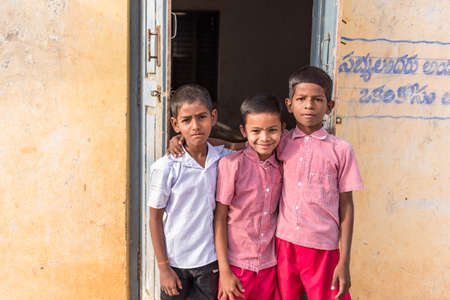 PUTTAPARTHI, ANDHRA PRADESH, INDIA - JULY 9, 2017: Portrait of three indian boys. Close-upのeditorial素材