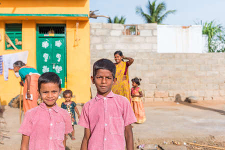 PUTTAPARTHI, ANDHRA PRADESH, INDIA - JULY 9, 2017: Portrait of two cheerful indian boys. Close-upのeditorial素材
