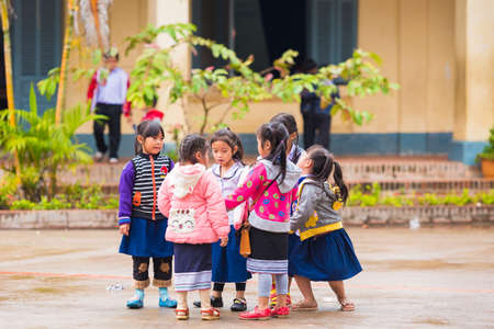 LOUANGPHABANG, LAOS - JANUARY 11, 2017: Children in the school yard.のeditorial素材