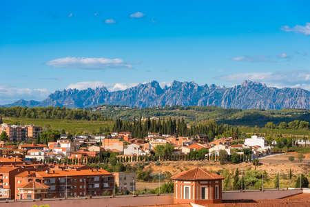 BARCELONA, CATALONIA, SPAIN - SEPTEMBER 11, 2017: View of the building in the valley of the mountains of Montserrat. Copy space for textのeditorial素材