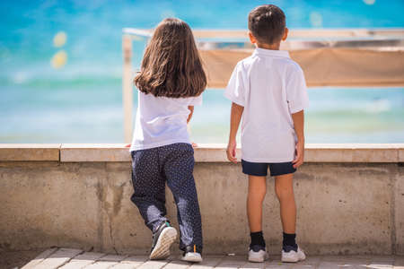 Boy and girl on the promenade in Salou, Tarragona, Spain. Close-upの写真素材