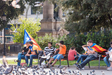 BARCELONA, SPAIN - OCTOBER 3, 2017: Demonstrators on the bench in the city centerのeditorial素材