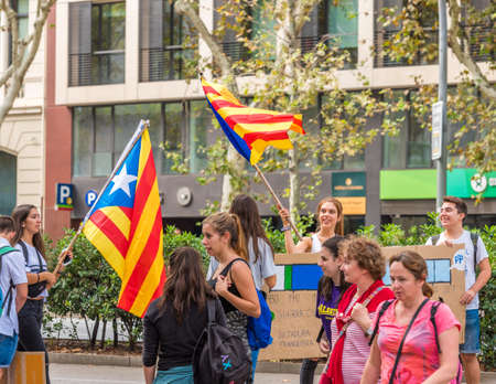 BARCELONA, SPAIN - OCTOBER 3, 2017: Demonstrators bearing catalan flags during protests for independence in Barcelonaのeditorial素材
