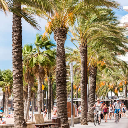 SALOU, TARRAGONA, SPAIN - SEPTEMBER 17, 2017: Cyclists ride along the waterfront. Close-up