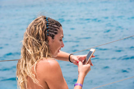 SAONA, DOMINICAN REPUBLIC - MAY 25, 2017: Woman on the background of the sea. Copy space for textのeditorial素材