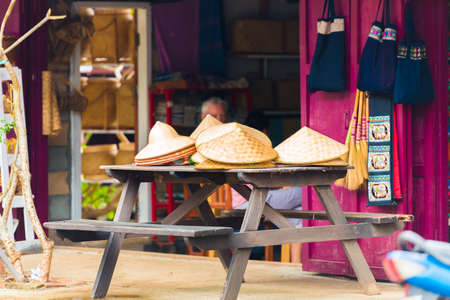 LOUANGPHABANG, LAOS - JANUARY 11, 2017: Hats in the city market. Copy space for textのeditorial素材