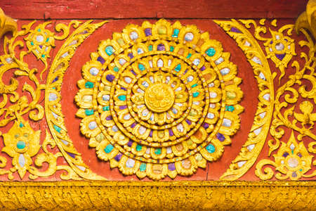 The bas-relief on the wall of the temple in Louangphabang, Laos. Close-upのeditorial素材