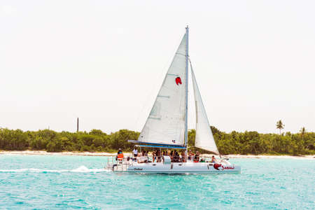 SAONA, DOMINICAN REPUBLIC - MAY 25, 2017: Sailing yacht on the shore of the island Saona. Copy space for textのeditorial素材