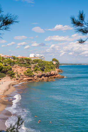 View of the coastline of the Costa Dorada in Miami Platja, Tarragona, Catalunya, Spain. Copy space for text. Verticalのeditorial素材