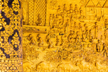 The bas-relief on the wall of the temple in Louangphabang, Laos. Close-upの写真素材