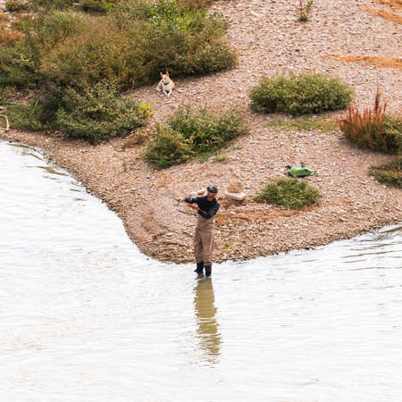 SARAGOSSA, SPAIN - SEPTEMBER 27, 2017: Fisherman on the river Ebro. Copy space for textのeditorial素材