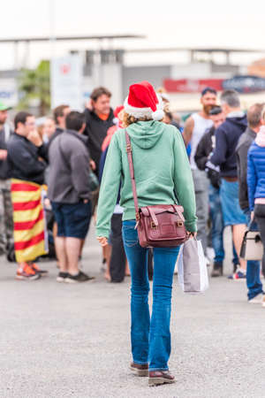AGDE, FRANCE - SEPTEMBER 9, 2017: Woman in a New Year's hat, Agde, France. Copy space for text. Vertical. Verticalのeditorial素材