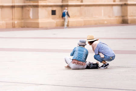 SARAGOSSA, SPAIN - SEPTEMBER 27, 2017: Tourists in Pilar Square. Copy space for textのeditorial素材